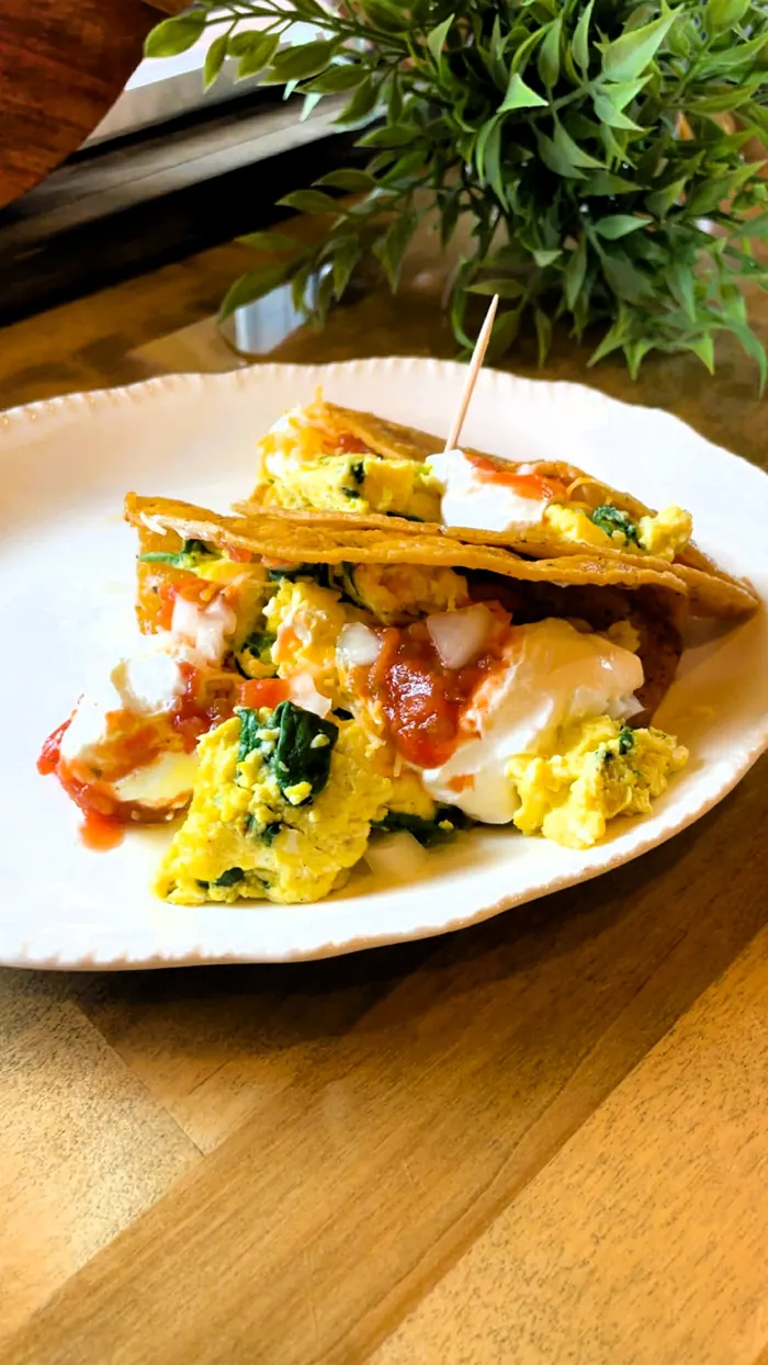 Breakfast tacos made with J&D Peters corn tortillas, filled with scrambled eggs, sour cream and salsa